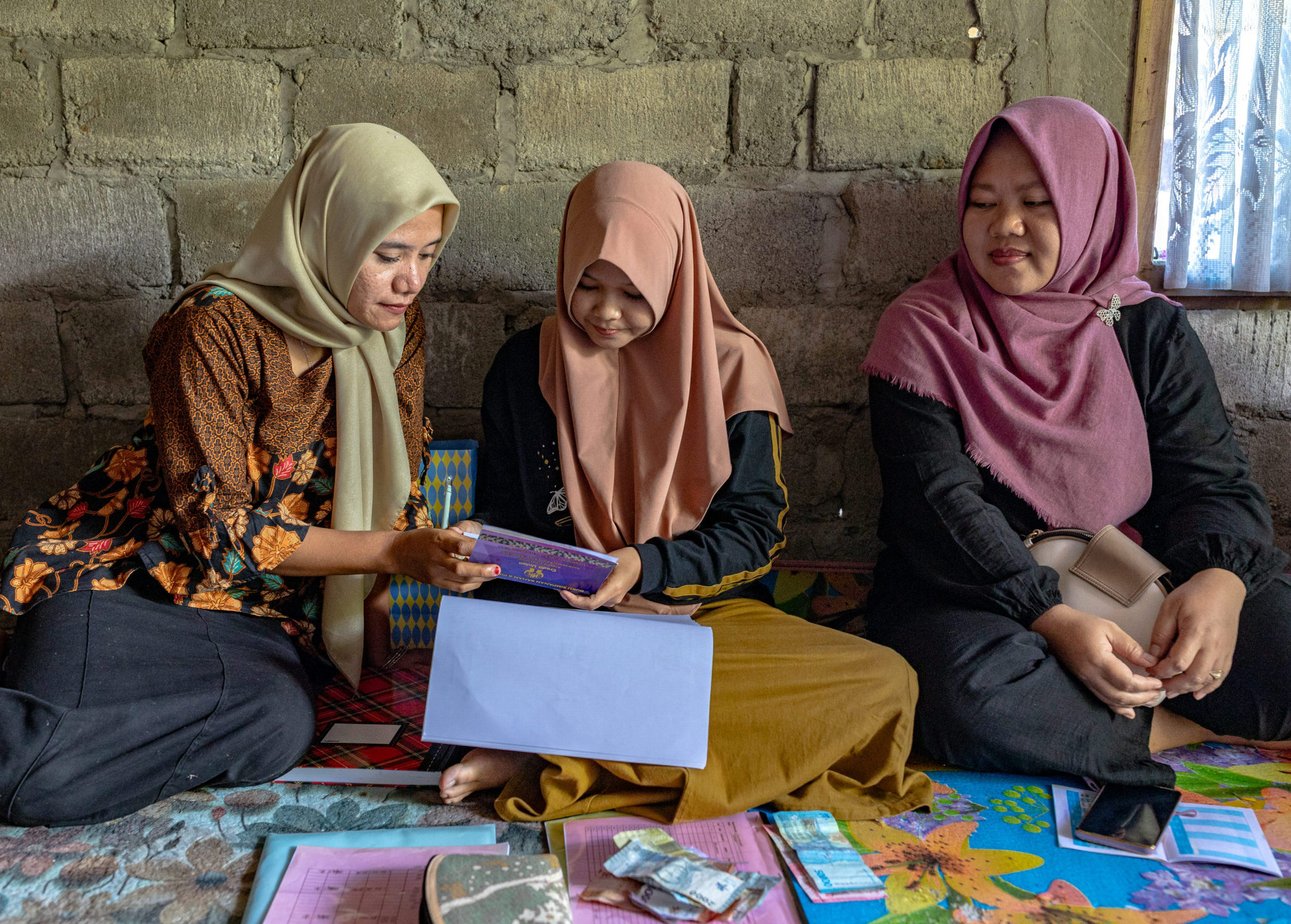 Women's Credit Union members gather in Bengkulu Village.