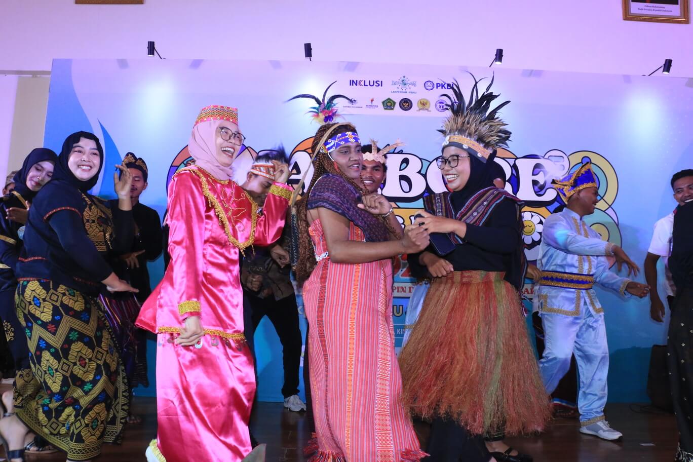 Participants in traditional Indonesian costumes perform a dance during the cultural night.