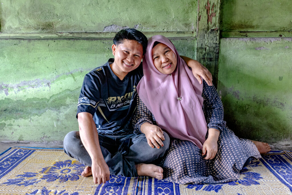 A former juvenile detainee poses with his mother.