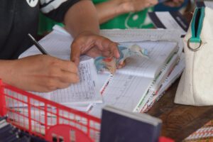 Ratna Wulan Devi, also known as Dewi, records members’ contributions to the Lampion Merah Abadi Cooperative in Belimbing Village, Kosambi, Tangerang, Banten, on Thursday (20 August 2026). The Lampion Merah Abadi Cooperative contributes to strengthening the economic capacity of members of the Belimbing Village community.